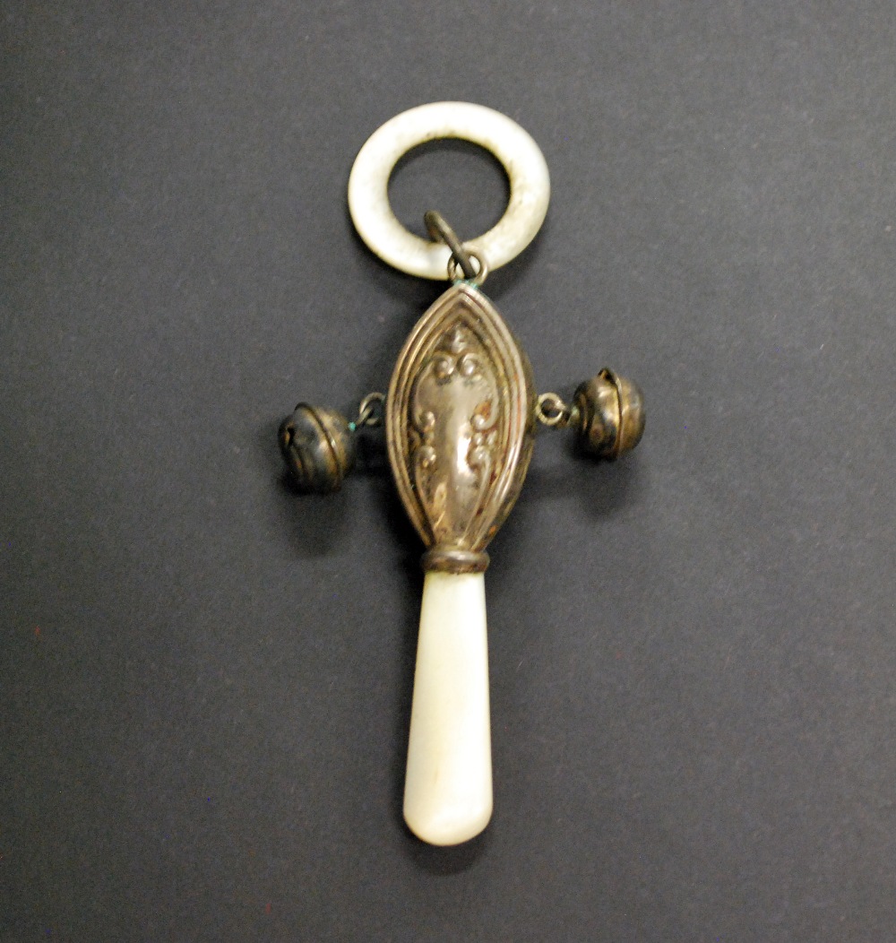 A hallmarked-silver and mother-of-pearl rattle with a teething ring