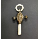 A hallmarked-silver and mother-of-pearl rattle with a teething ring