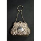 Hallmarked silver repousse decorated fitted purse.