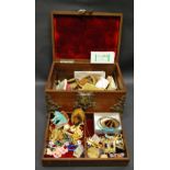 A quantity of costume jewellery in a decorative casket.