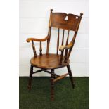 A 19th Century continental elm Gentleman's elbow chair with turned supports.