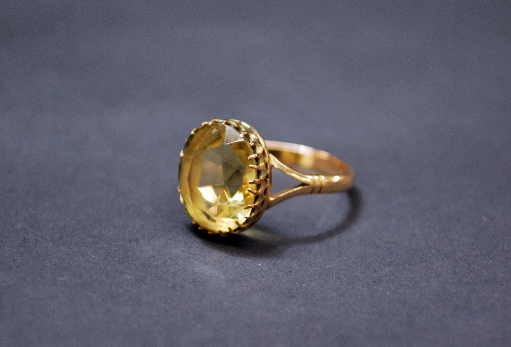 A 9ct gold ladies dress ring set with a large citrine