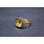 A 9ct gold ladies dress ring set with a large citrine
