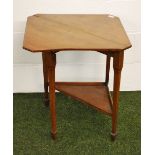 An Arts and Crafts mahogany corner drop-leaf table with sliding rear support leg