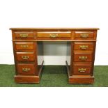 An Edwardian mahogany twin pedestal desk.