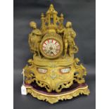 A 19th Century gilt metal French table clock with painted porcelain dial on a gilt stand to accord.