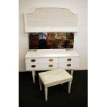 A vintage dressing table with stool,