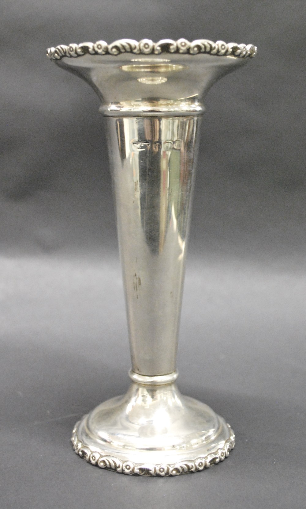 A hallmarked-silver trumpet vase. Weight approximately 101.