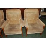 A matching set of four vintage Danish style teak framed easy chairs.