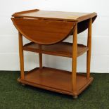 Mid 20th Century drop leaf tea trolley in teak.