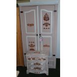 A painted two-door wardrobe and a small chest of drawers