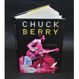 Chuck Berry autograph on his book.