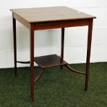 An Edwardian square parlour table in mahogany with checkered inlay.