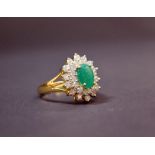 An emerald and diamond cluster ring, set in 18ct gold.