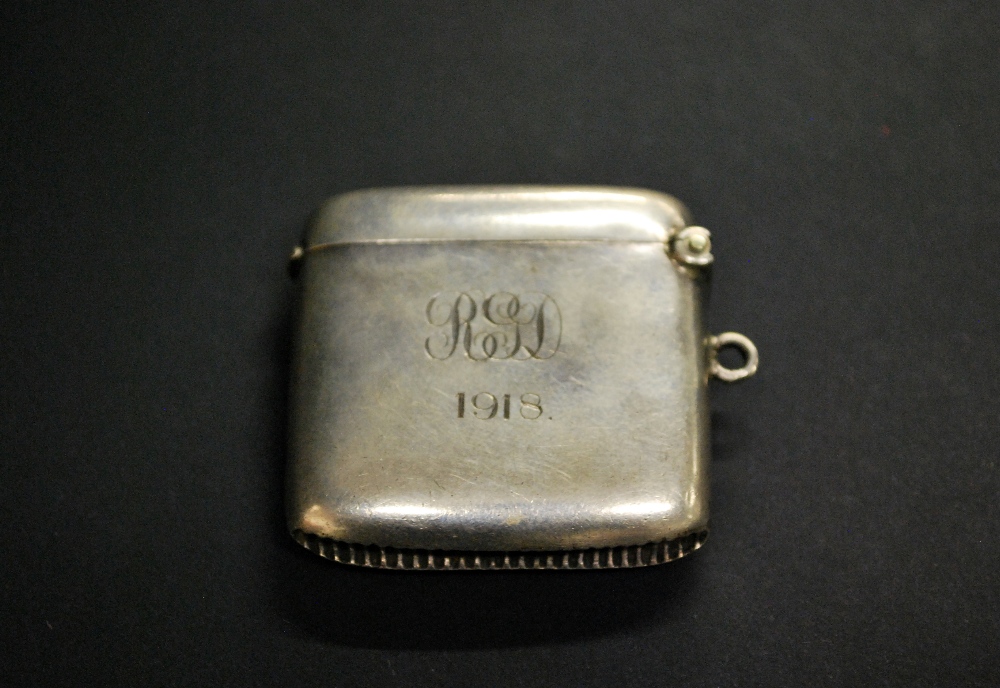 A hallmarked-silver vesta case, inscribed and dated 1918.