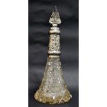 A heavily cut glass silver mounted perfume bottle with stopper.