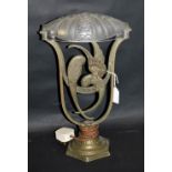 A French Art Deco desk lamp of arched form with two parrots and a frosted glass shade