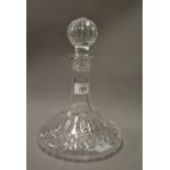A heavily cut glass ships decanter. Approximately 26 cm tall.