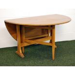 An Ercol Golden Dawn elm Space-Saver drop-leaf table