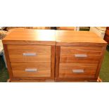 A pair of modern bedside cabinets. appro