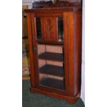 A glazed single door music cabinet in ma