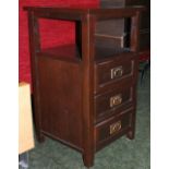 A mahogany three-drawer telephone table