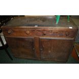 An oak sideboard of two drawers above tw