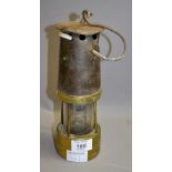 A miners lamp. Approximately 25 cm high.