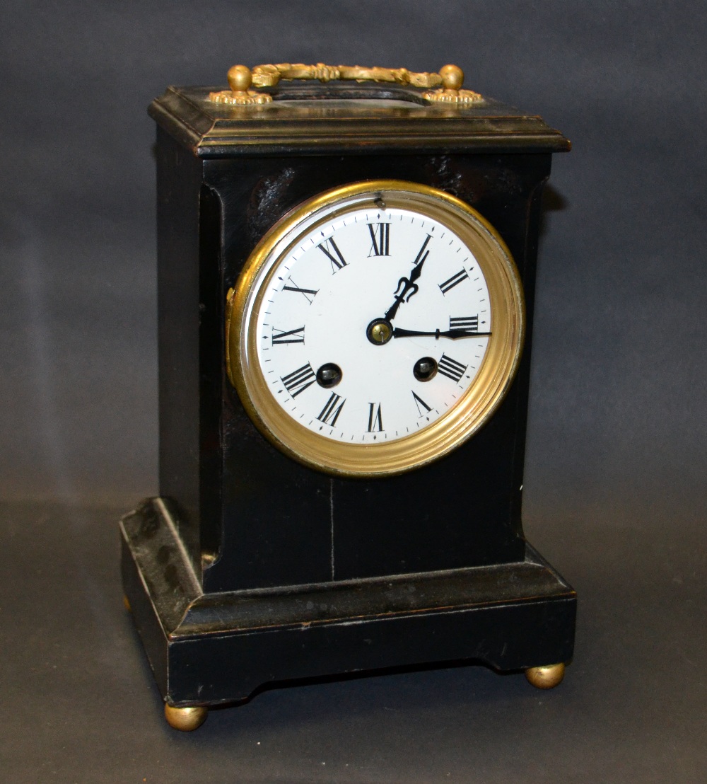 An ebonised French bracket clock having a circular enamelled dial with Roman chapters. - Image 3 of 3