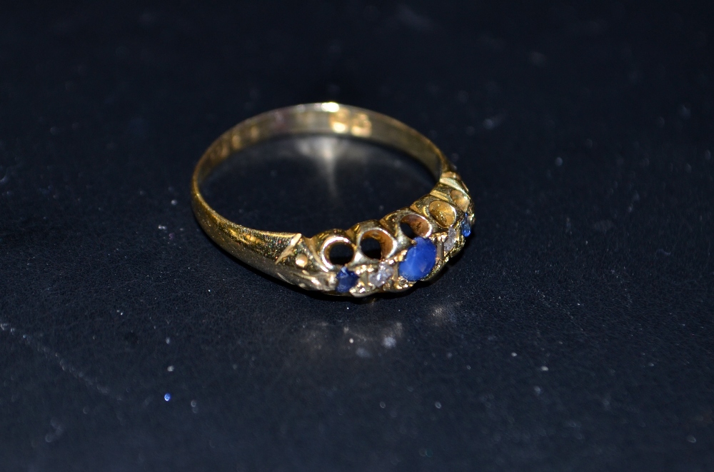 An 18ct gold ring, set with diamonds and sapphires, Hallmark possibly 1901,