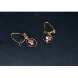 A pair of 9ct gold earrings set with pink sapphires approximately 0.