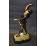 An Art Deco style figure with a spelter body & composite arms and head raised on an onyx plinth