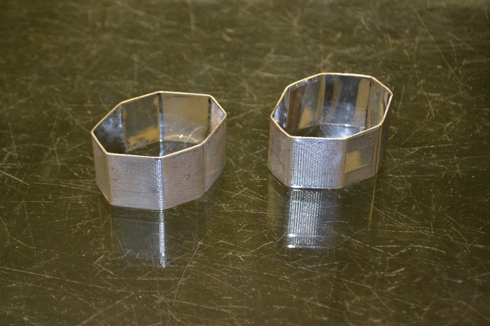 Two octagonal silver napkin rings, 1935, plain cartouche with special silver Jubilee hallmark,