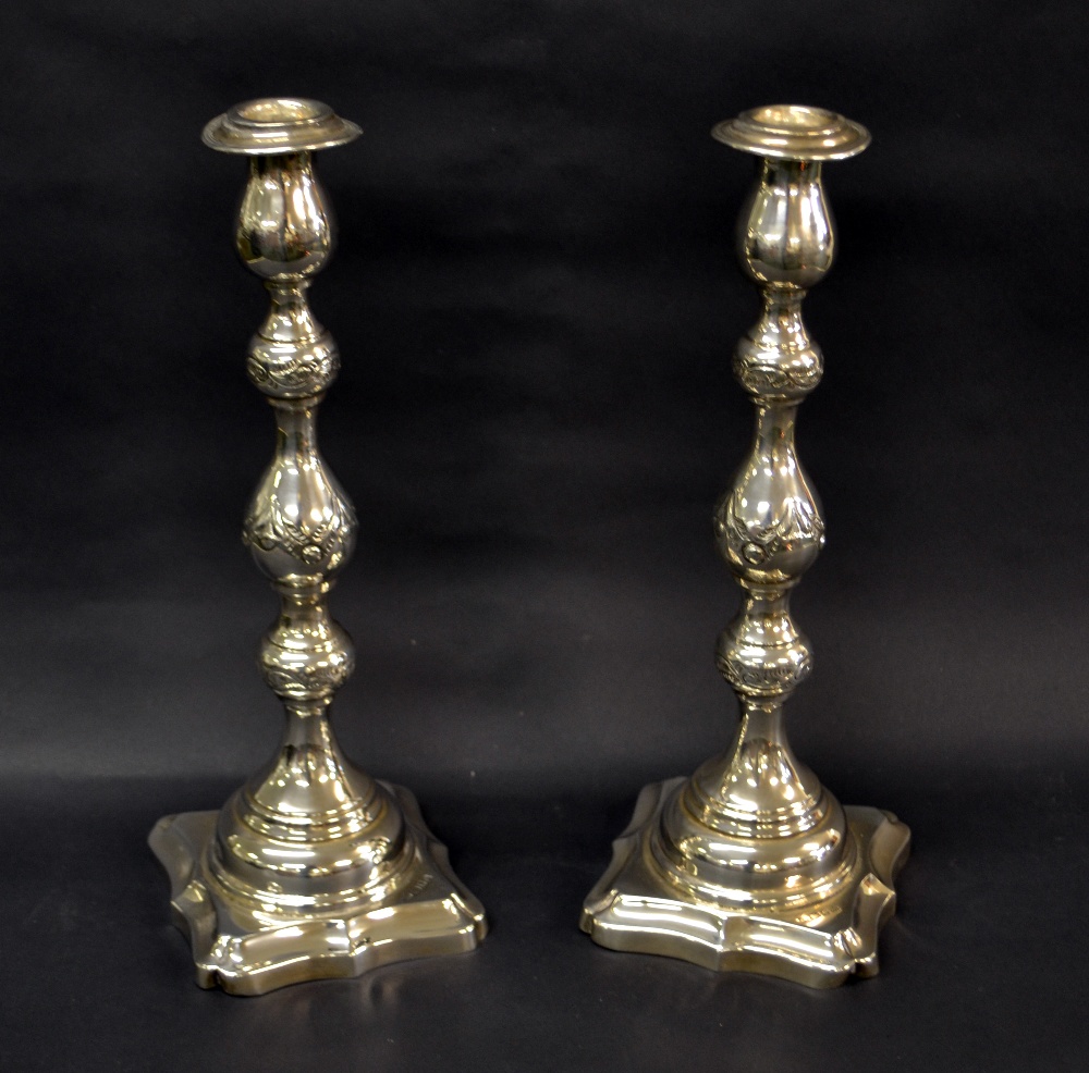 A hallmarked-silver pair of candlesticks