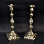 A hallmarked-silver pair of candlesticks