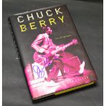 Chuck Berry autograph on his book.