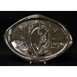 A hallmarked silver art nouveau tray, relief decoration of flora, with a raised lobed edge.