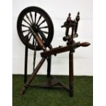 A 19th century oak spinning wheel