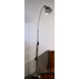 A contemporary brushed-steel floor lamp