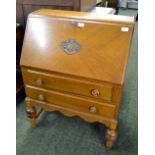 An oak bureau, the fitted interior with