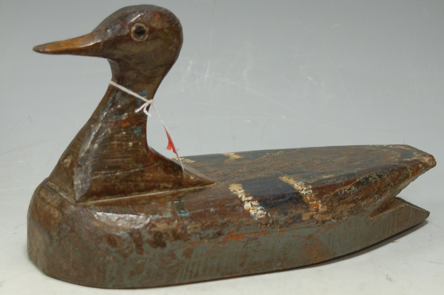 A 19th century painted wooden decoy duck