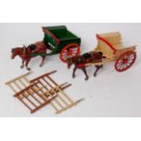 Britains, 2 unboxed tumbrel carts, one pre-war rare cream with red wheels,