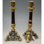 A pair of Napoleon III style gilt metal mounted table candlesticks