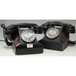 An early 20th century bakelite telephone together with one other (2)