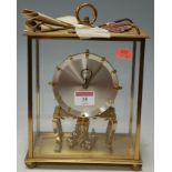 A 1960s Kundo Black Forest brass cased four glass anniversary clock