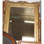 A 19th century giltwood and gesso picture frame with later inset mirrorplate