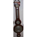 An early 19th century mahogany and satinwood strung five dial wheel barometer