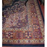 A Persian style machine woven woollen carpet 370x275cm