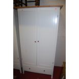 A pair of modern white wood double door wardrobes each having single long lower drawer