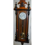 An early 20th century walnut and ebonised Vienna type regulator with twin weight driven movement